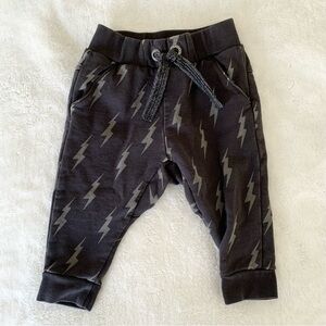 Dark grey baby pants with lightning bolts, size 6M